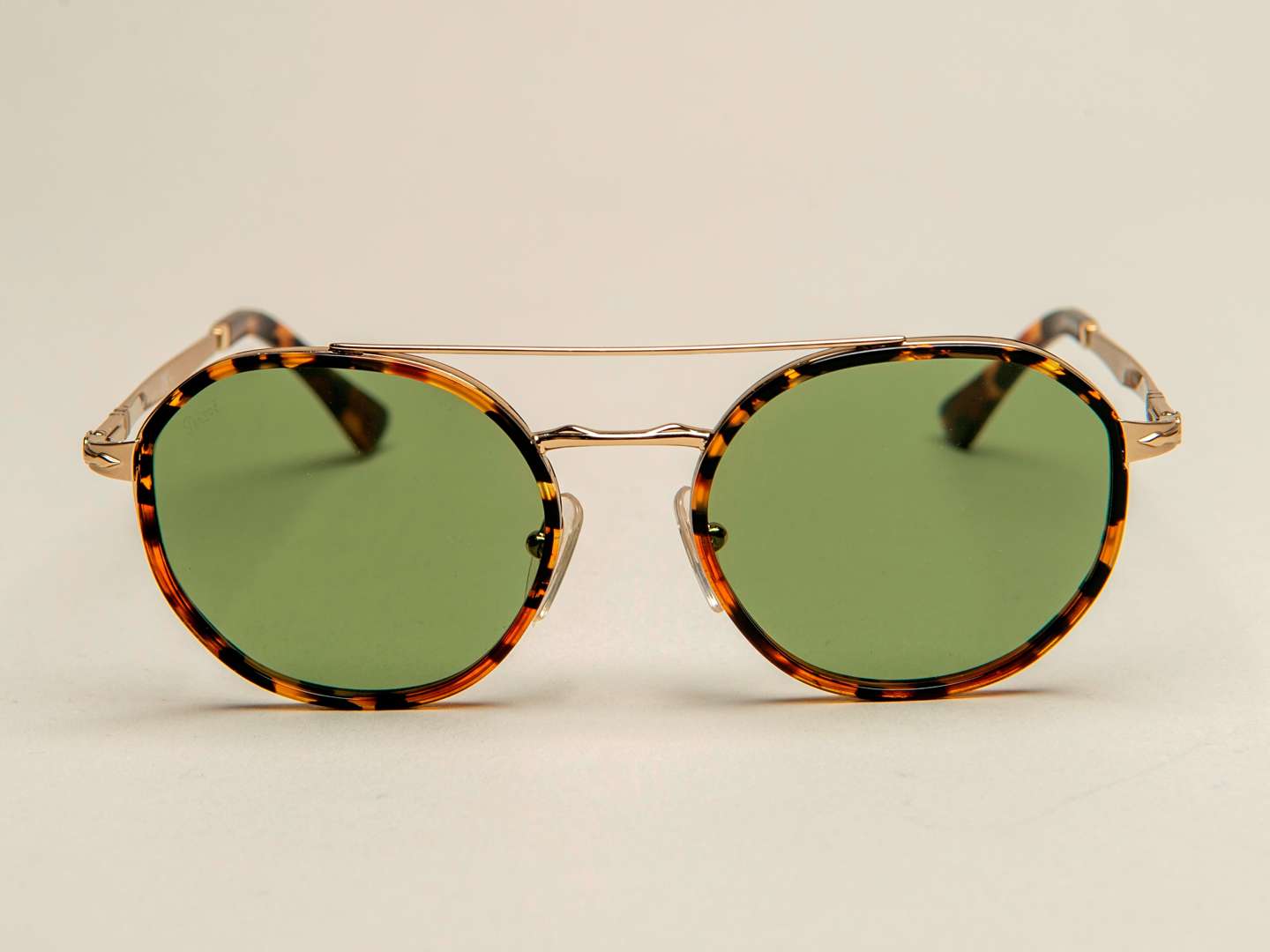 <p>PERSOL, a pair of Italian gilt and tortoiseshell sunglasses</p>