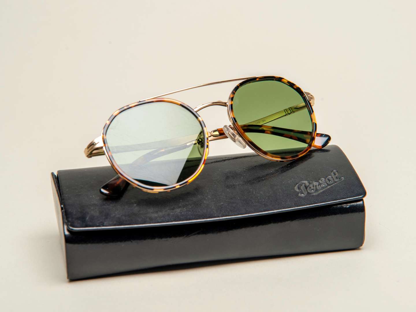 <p>PERSOL, a pair of Italian gilt and tortoiseshell sunglasses</p>