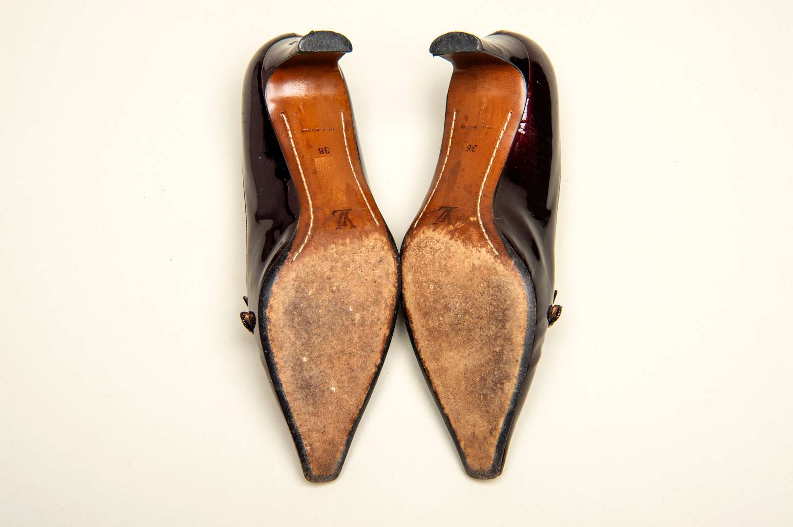 <p>LOUIS VUITTON, a pair of dark bronze, patent leather pumps</p>