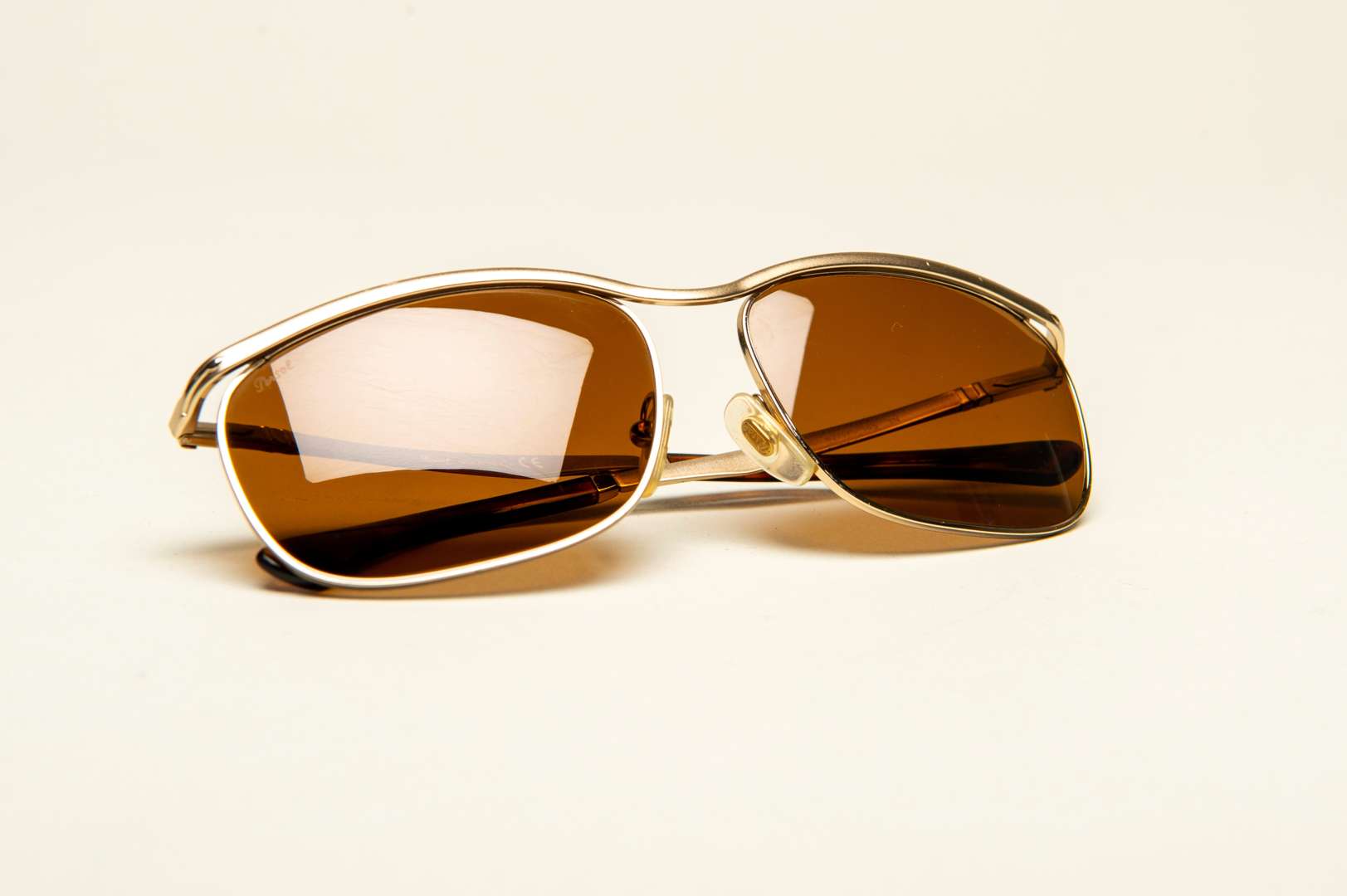 <p>PERSOL, a pair of Italian gilt framed sunglasses</p>