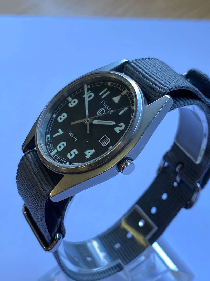 <p>PULSAR, a stainless steel, quartz, military issue, centre seconds, calendar wristwatch, 2002, G10,</p>