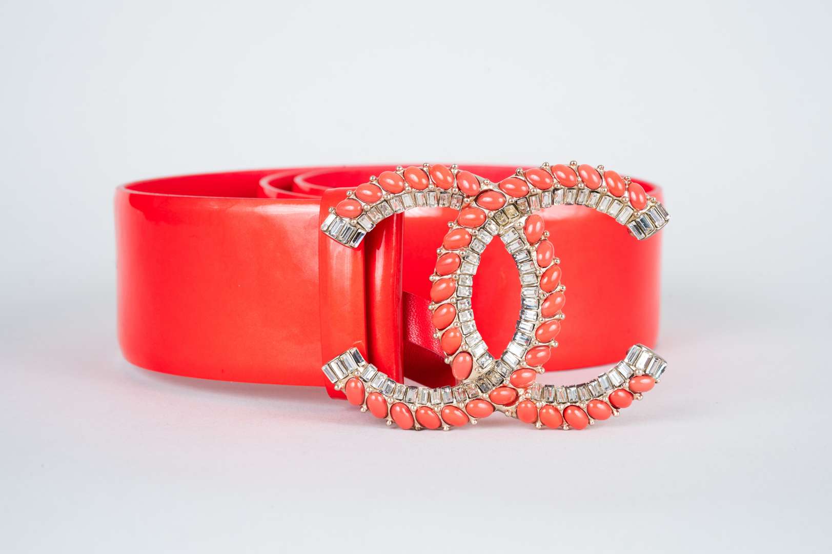 <p>CHANEL, coral red, patent leather belt</p>