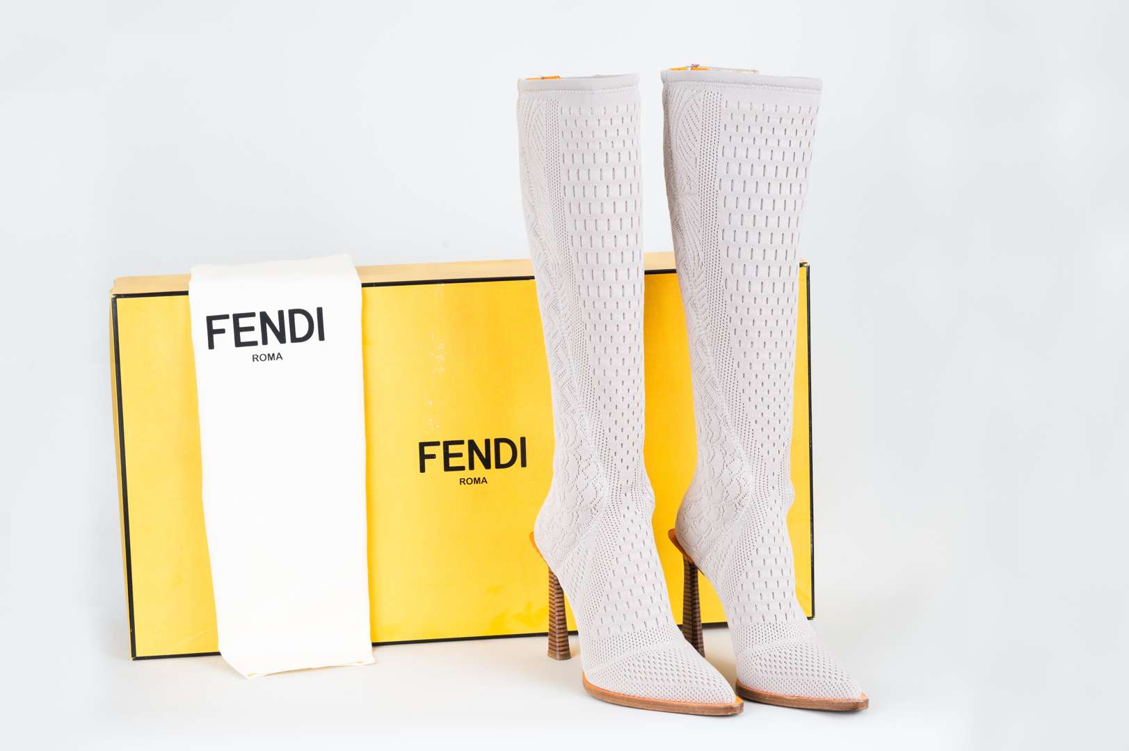 <p>FENDI, &nbsp;a pair of Fframe, knee high boots</p>