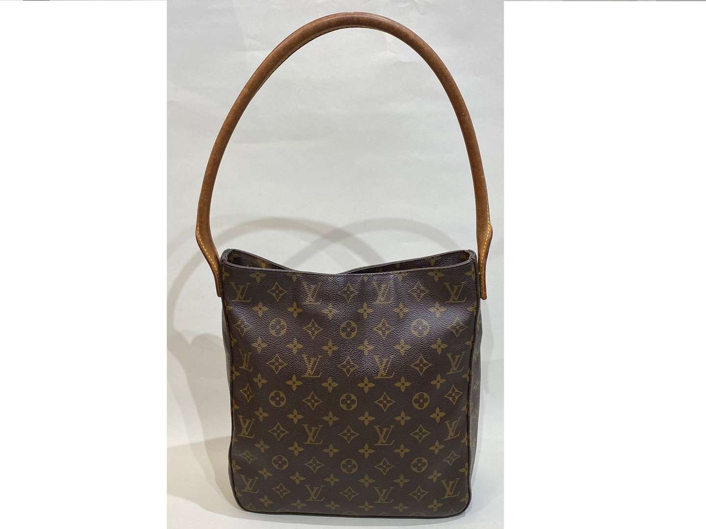 <p>LOUIS VUITTON, Looping, tan stitched leather and monogrammed shoulder bag</p>