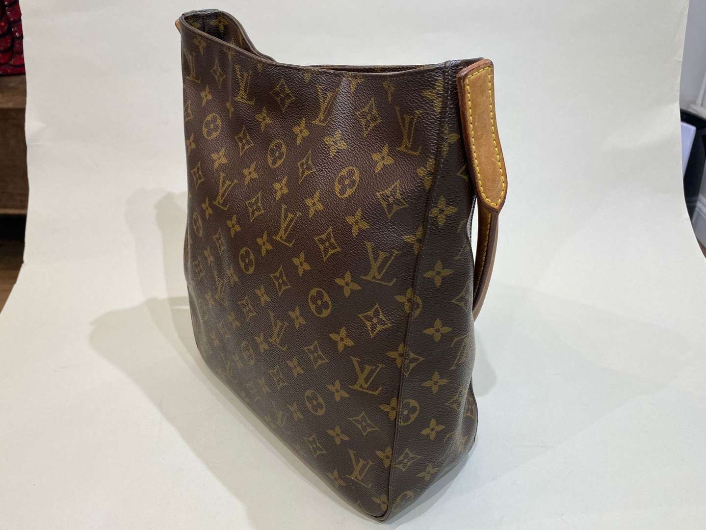 <p>LOUIS VUITTON, Looping, tan stitched leather and monogrammed shoulder bag</p>