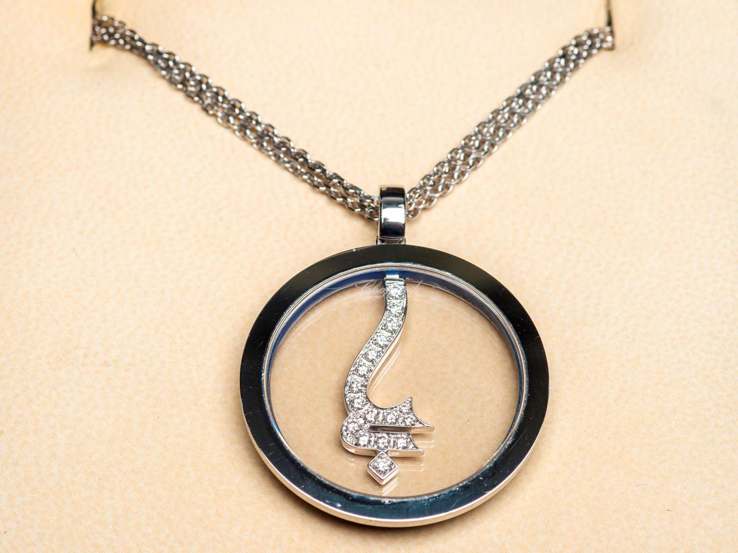 <p>CHOPARD for GODOLPHIN, a modern 18ct white gold and diamond set pendant and chain</p>