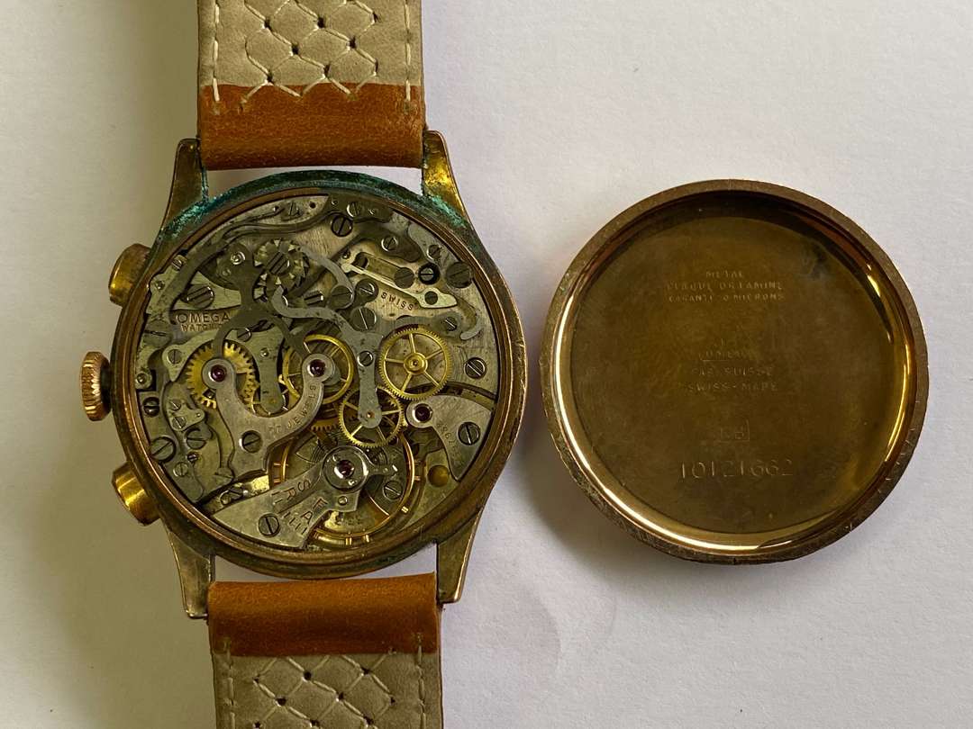 <p>OMEGA. a mid 20th century gold plated, two button, centre seconds chronograph.</p>