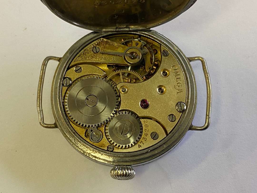 <p>OMEGA. an early 20th century base metal cased wristwatch.</p>