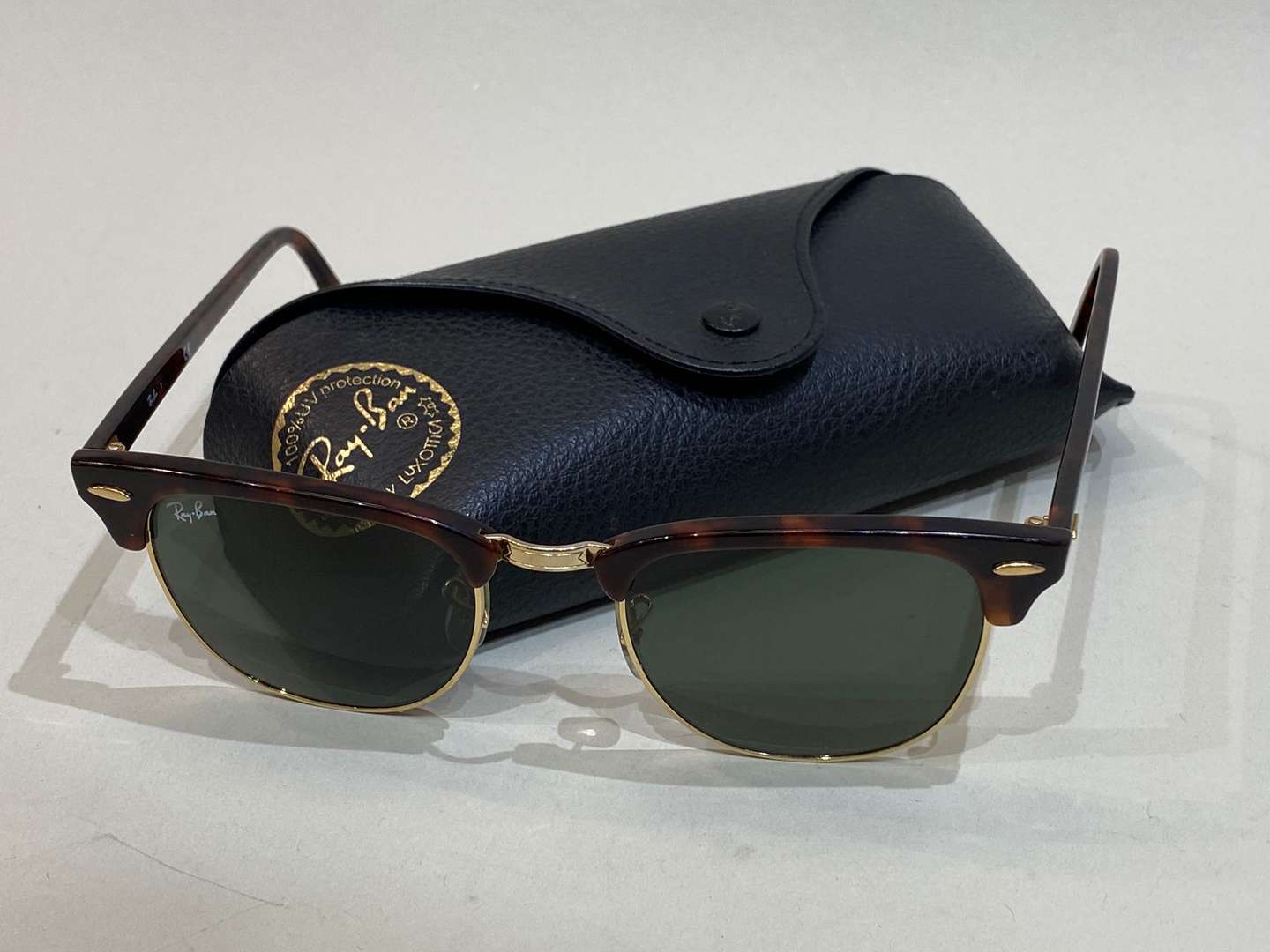 <p>RAY-BAN, a pair of Clubmaster, gilt and tortoiseshell sunglasses</p>