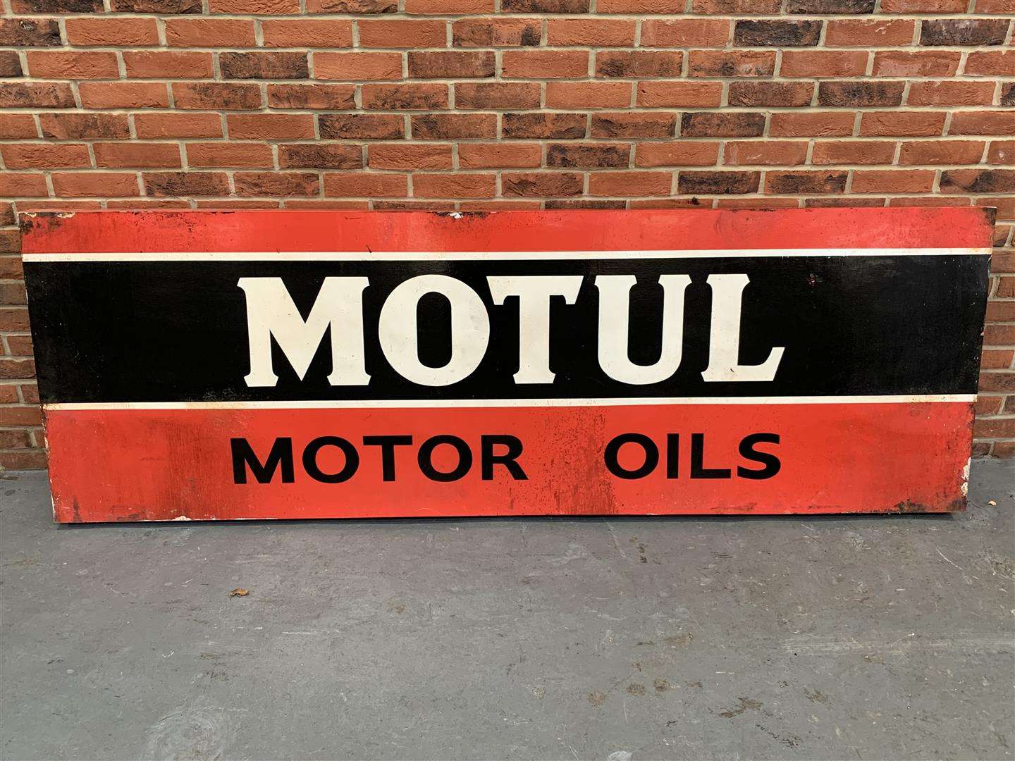 <p>Motul Motor Oils sign on board</p>