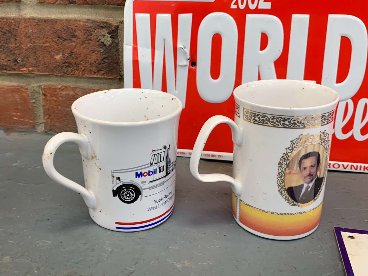 <p>Three Rally Plaques and Five Motoring Mugs</p>