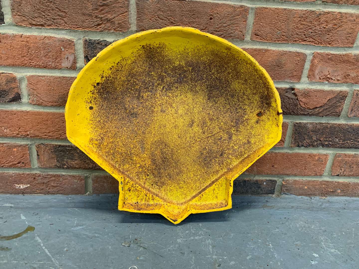 <p>Cast Iron Shell Sign</p>