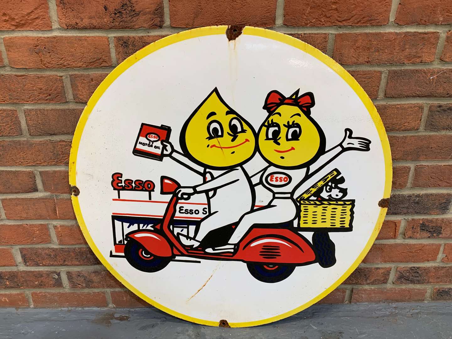 <p>Enamel Circular Mr and Mrs Drip on a Scooter Sign</p>