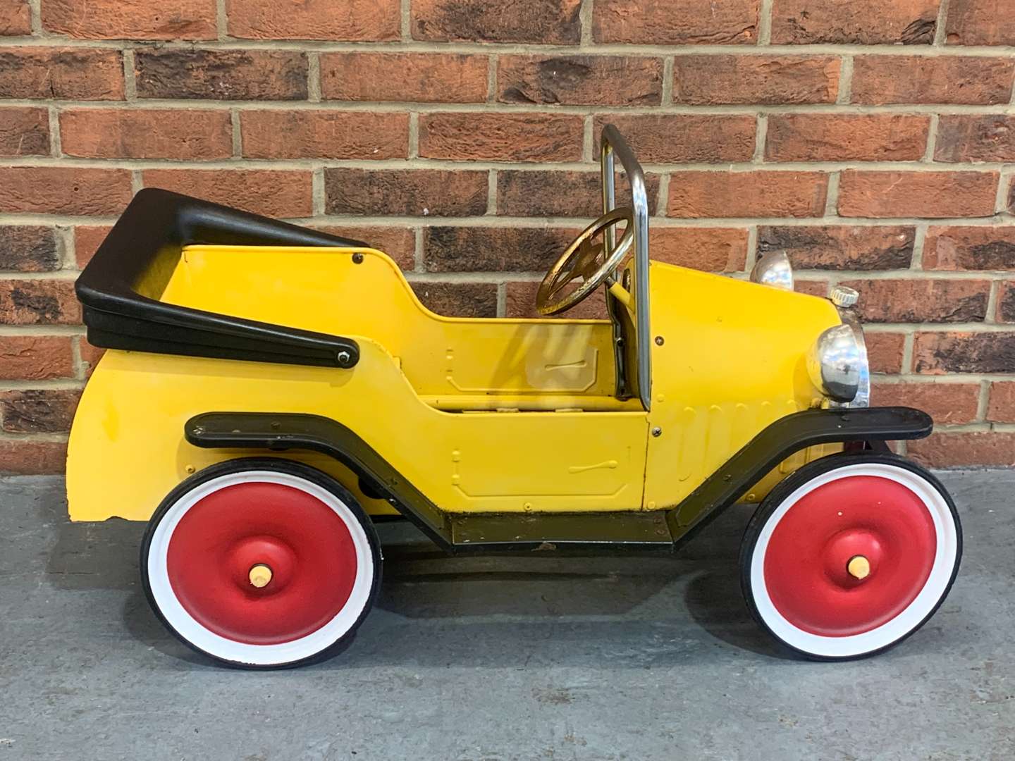 <p>Childs Tin Plate Pedal Car</p>