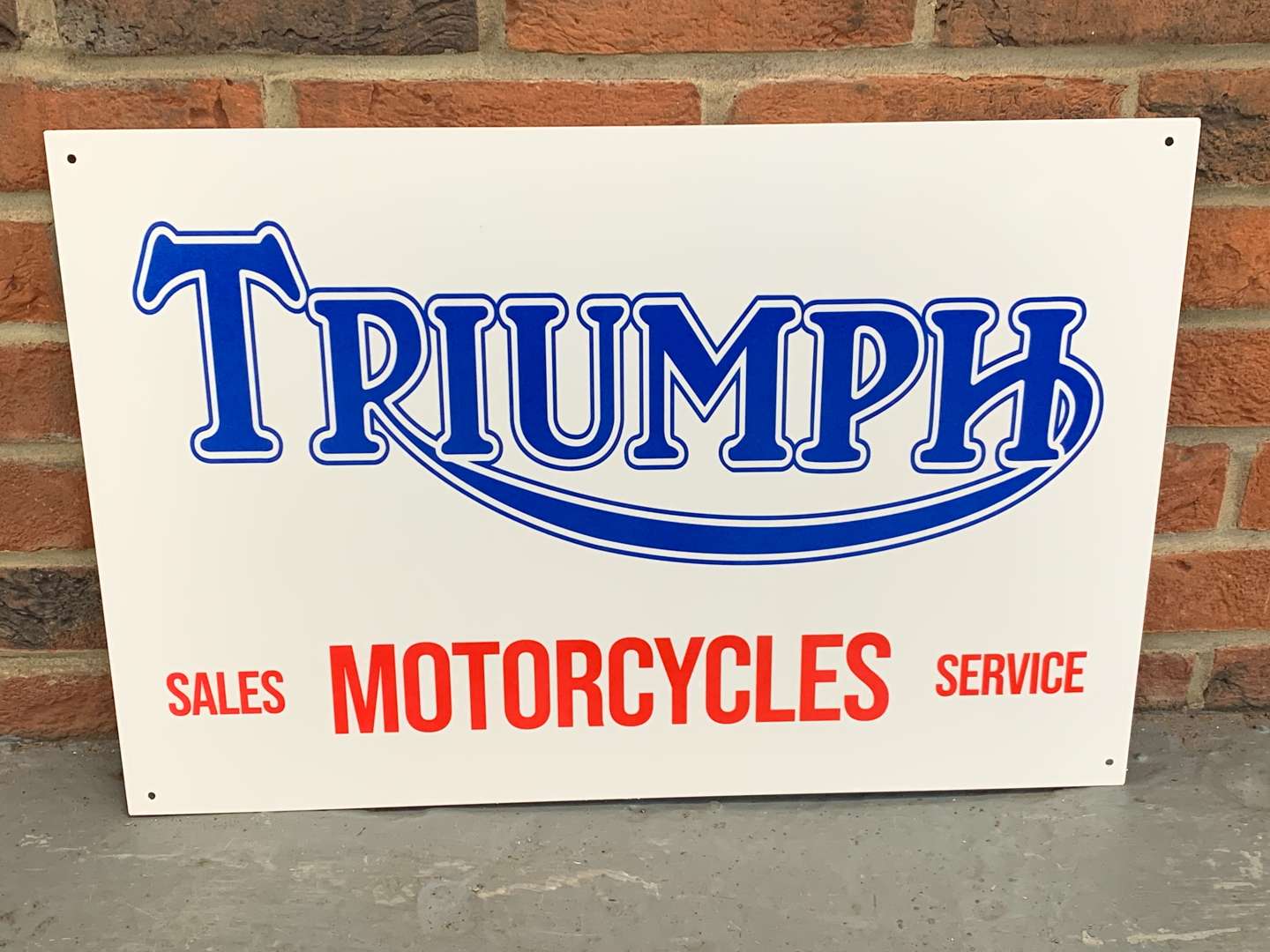 <p>Metal Triumph M/cycles Sales/Service Sign</p>