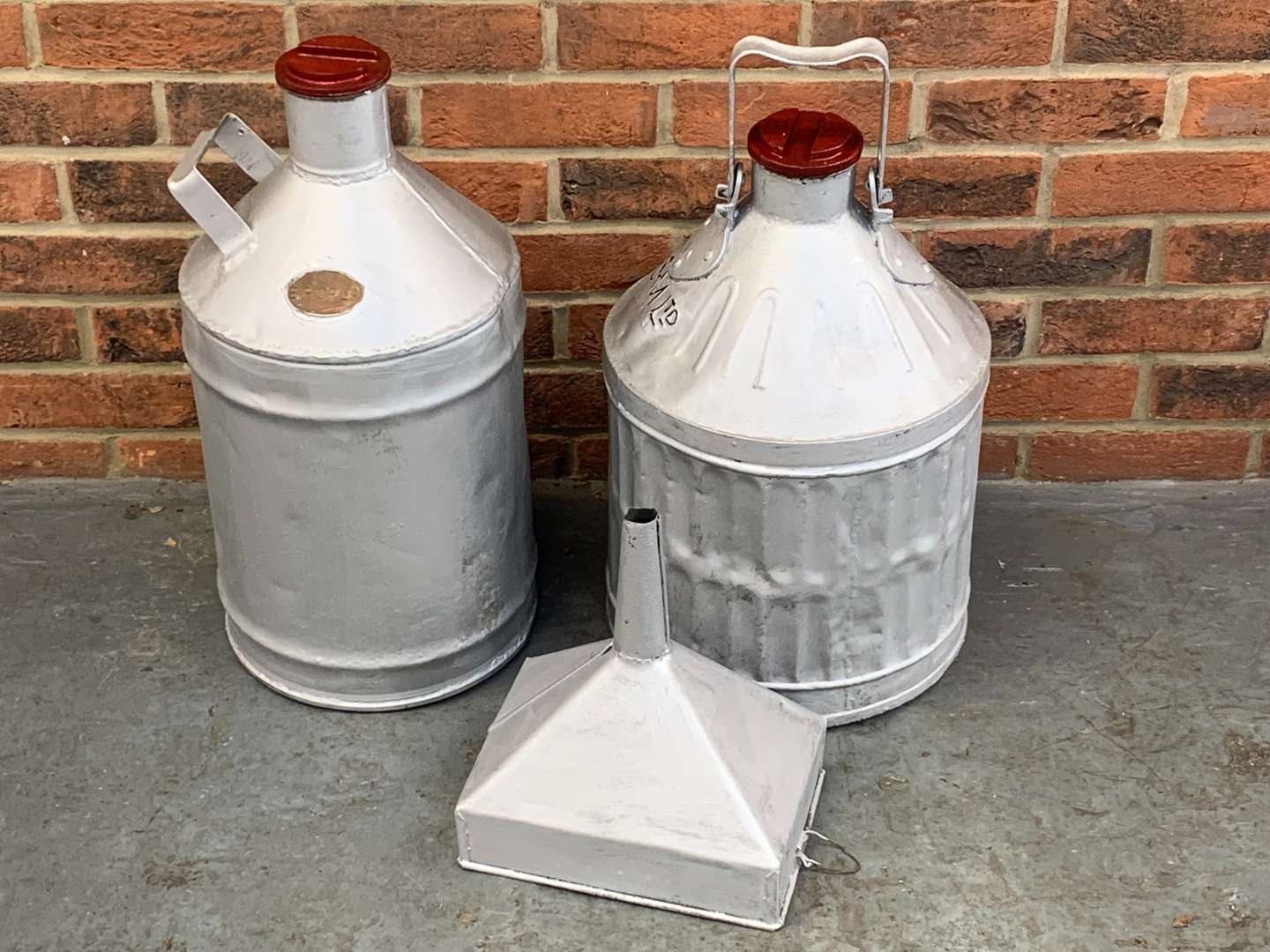 <p>Two Pre-War 5 Gallon Petrol Drums and Funnel (3)</p>