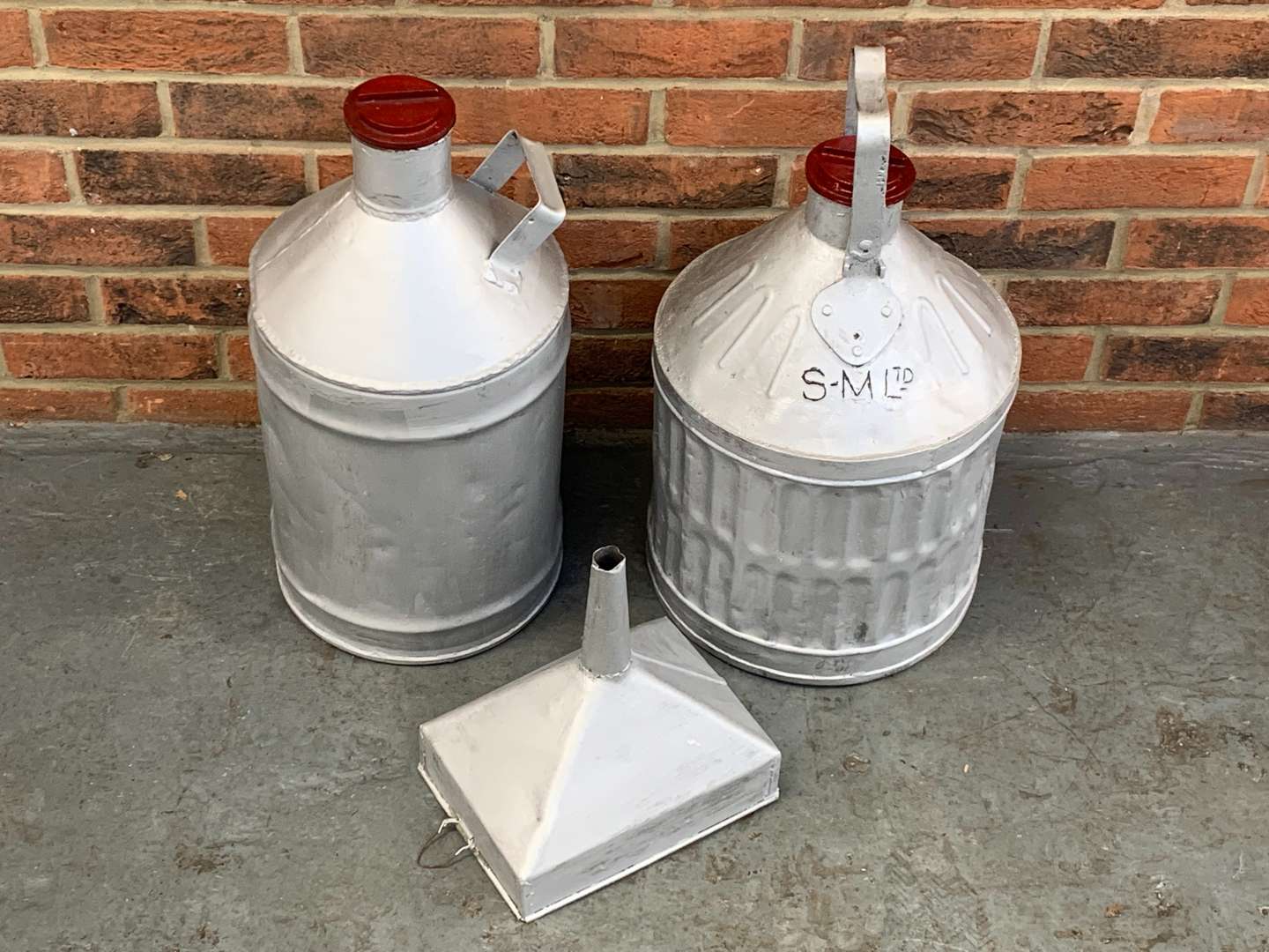 <p>Two Pre-War 5 Gallon Petrol Drums and Funnel (3)</p>