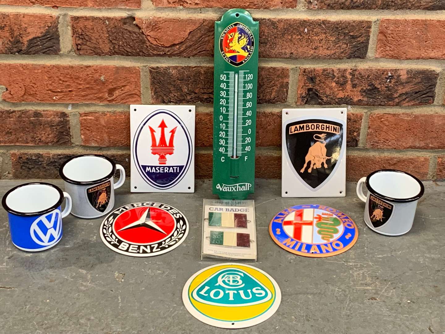 <p>Three Modern Enamel Mugs and Six Enamel Badges and Thermometer (10)</p>