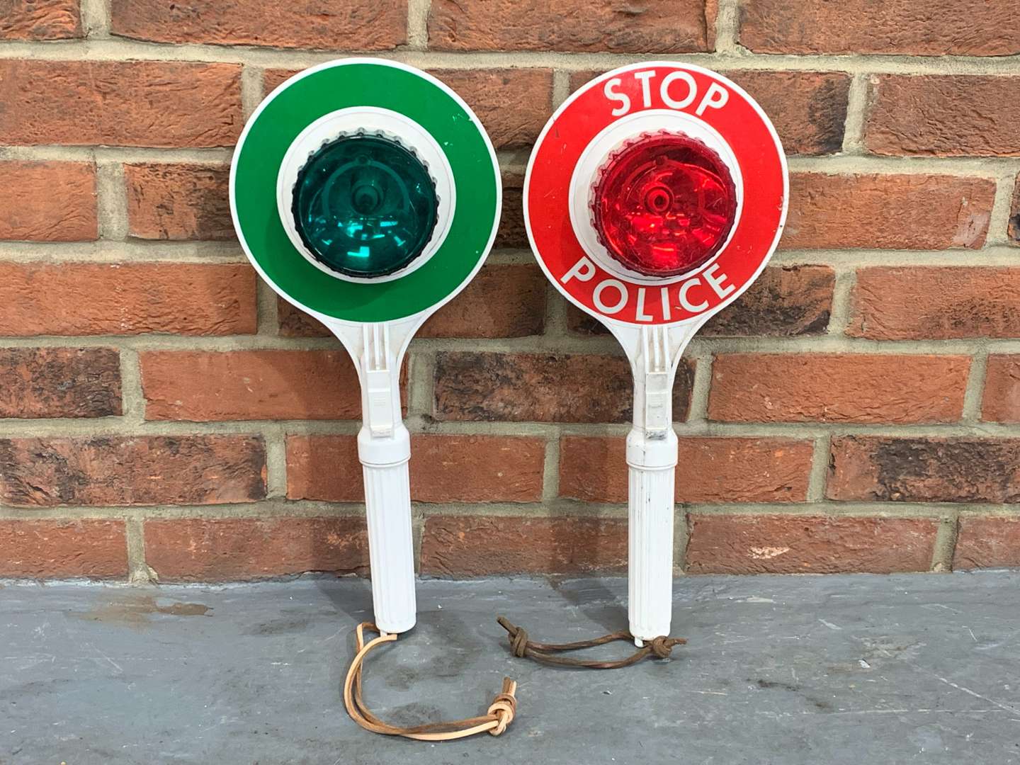 <p>Two Police Hand Stop/Go Signals&nbsp;</p>