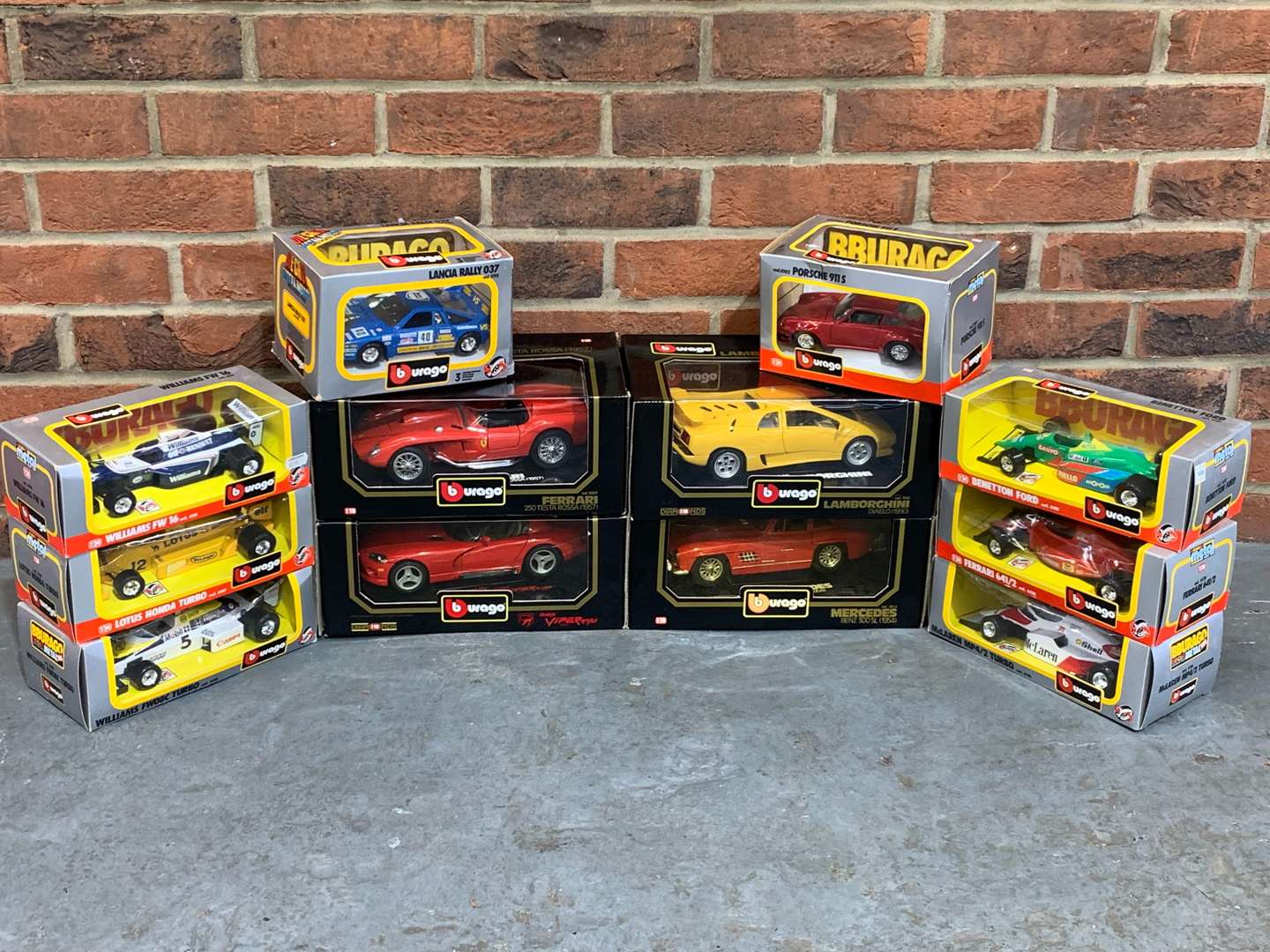 <p>Twelve Boxed Burago Model Cars</p>