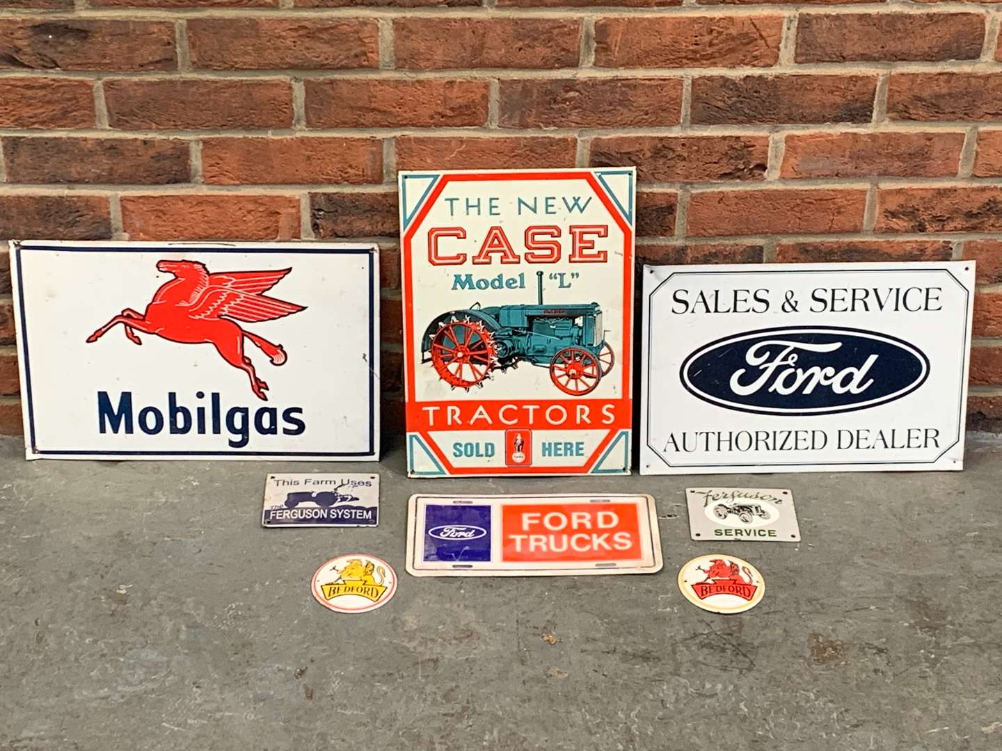 <p>Four Tin Signs and Four Enamel Signs (8)</p>