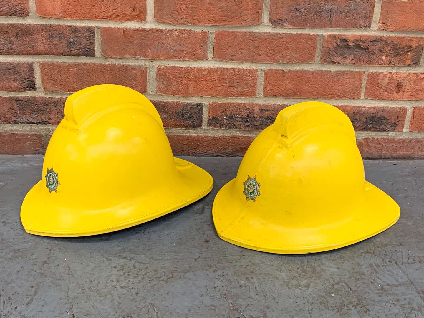 <p>Two Fireman Helmets</p>