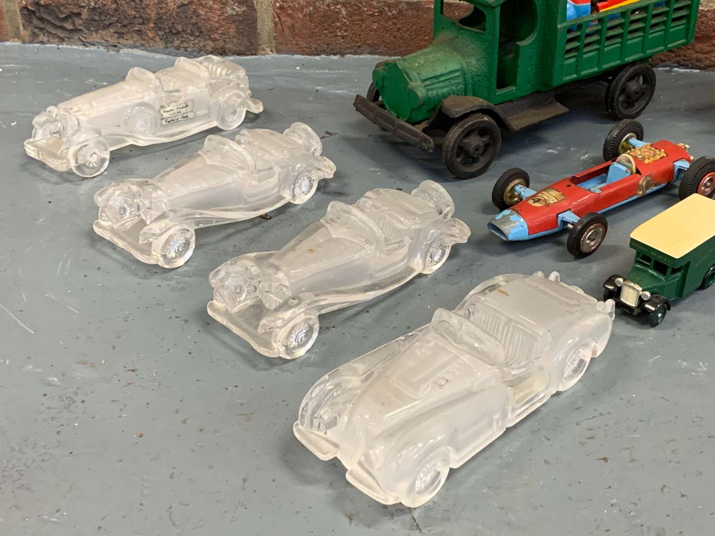 <p>Quantity of Die Cast/Tin Plate Model Cars and Four Glass Paperweights&nbsp;</p>
