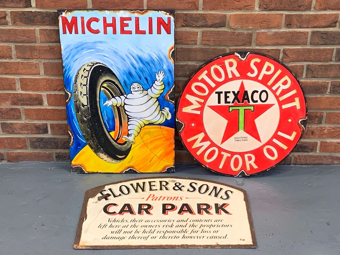 <p>Two Wooden Signs Michelin and Texaco and Metal Car Park Sign (3)&nbsp;</p>