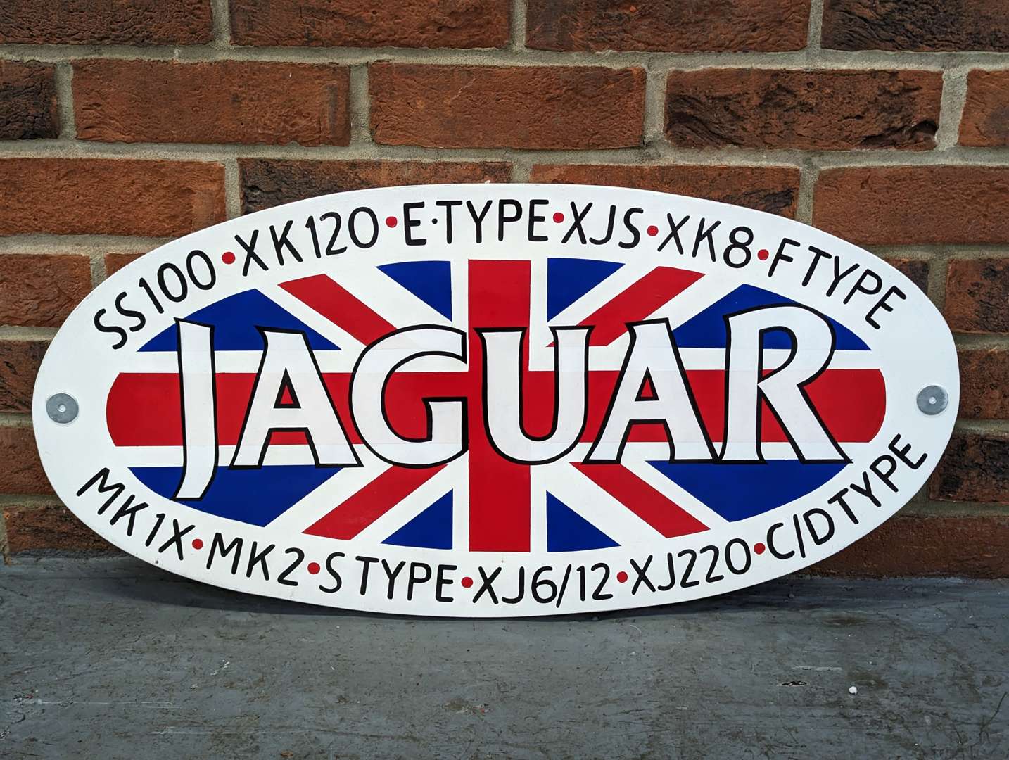 <p>Painted Wooden Jaguar Union Jack Oval Sign</p>