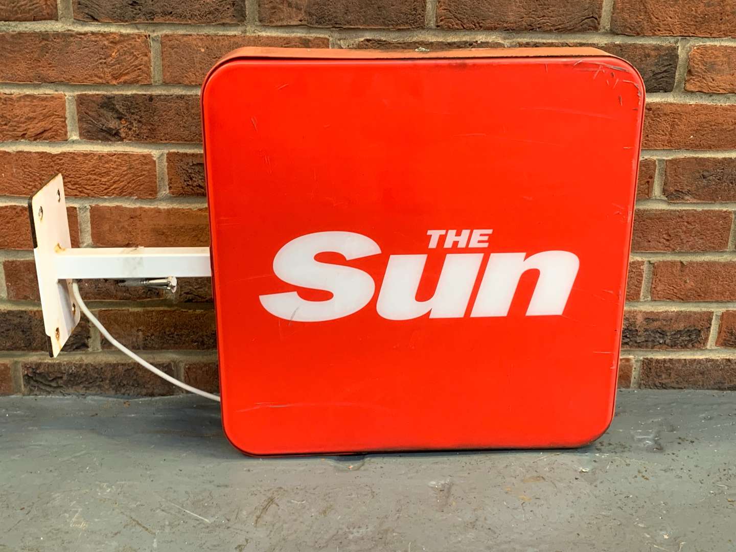 <p>Illuminated “The Sun” Advertising Sign</p>