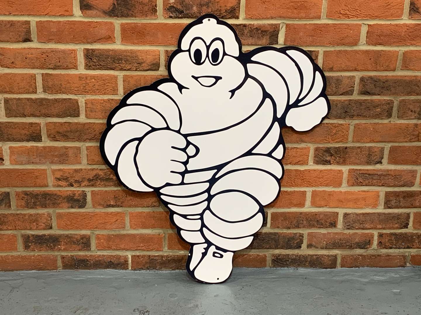 <p>Metal Michelin Running Man Sign</p>