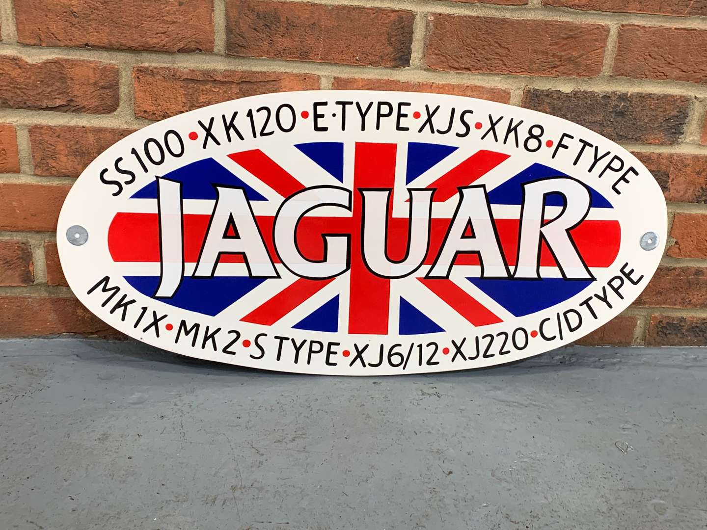 <p>Oval Painted Wooden Jaguar Union Jack Sign</p>