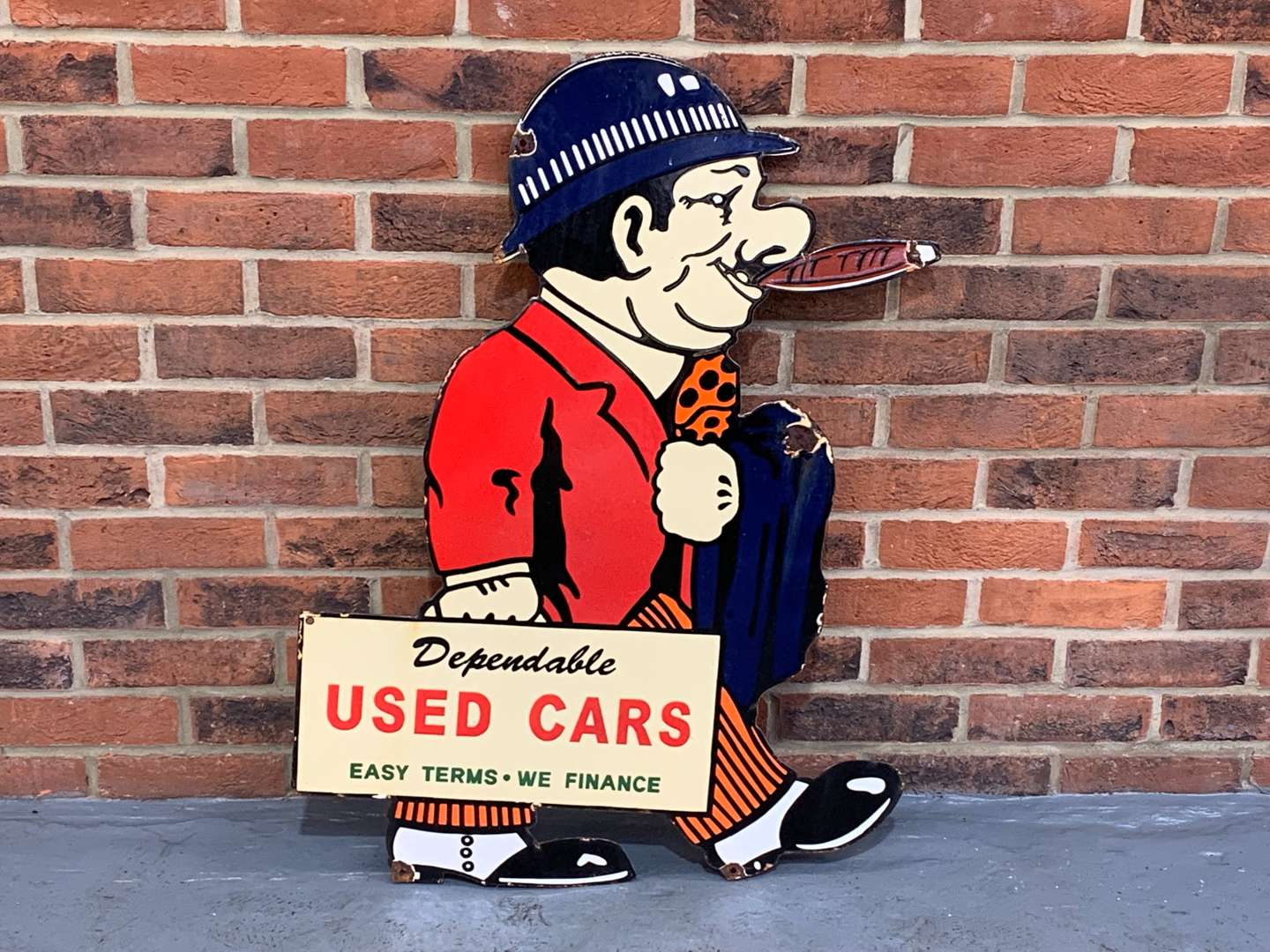 <p>Enamel Figural Dependable Used Cars Sign</p>