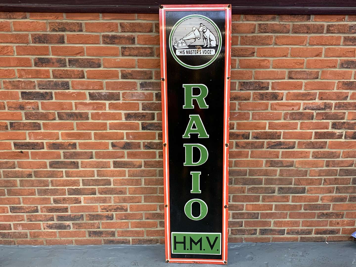 <p>Enamel HMV Radio Sign</p>