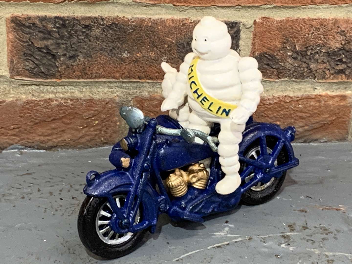 <p>Cast Iron Novelty Michelin Man Motorbike and Side Car</p>