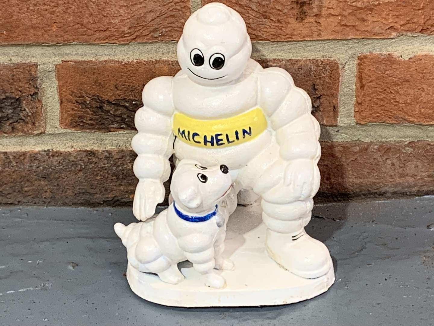 <p>Cast Iron Novelty Michelin Man and His Dog</p>