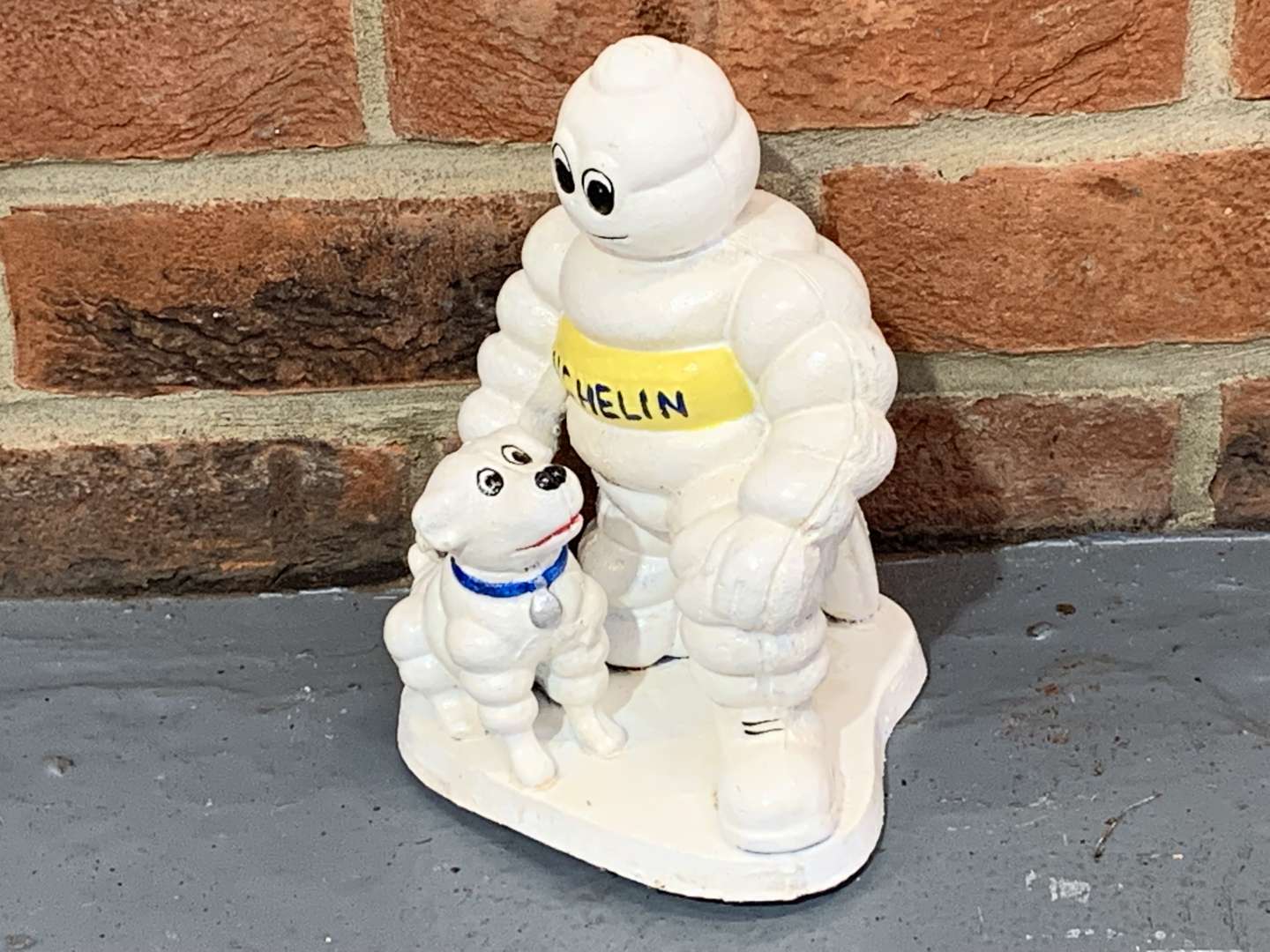 <p>Cast Iron Novelty Michelin Man and His Dog</p>