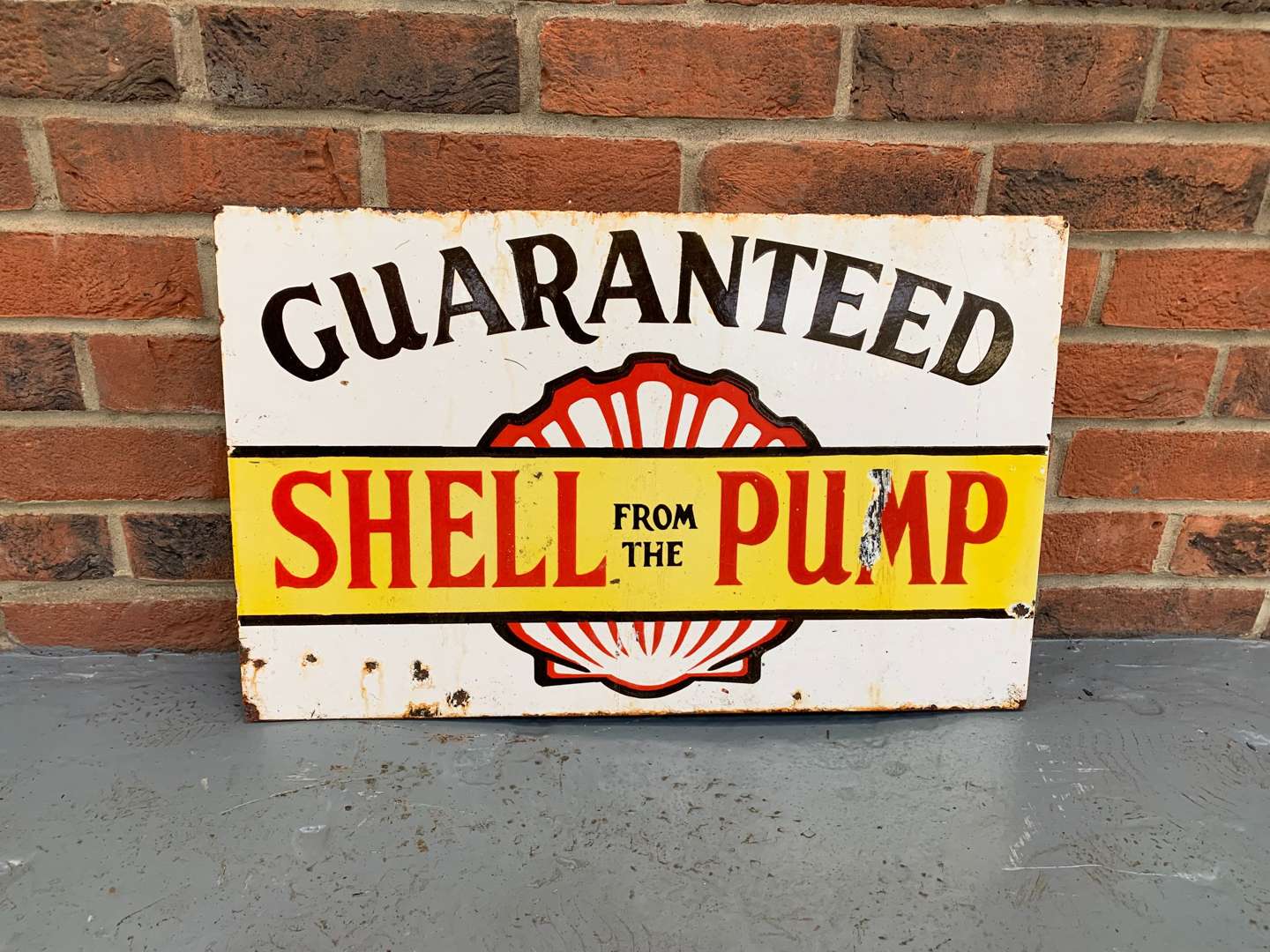 <p>Enamel Shell From The Pump Flange Sign</p>