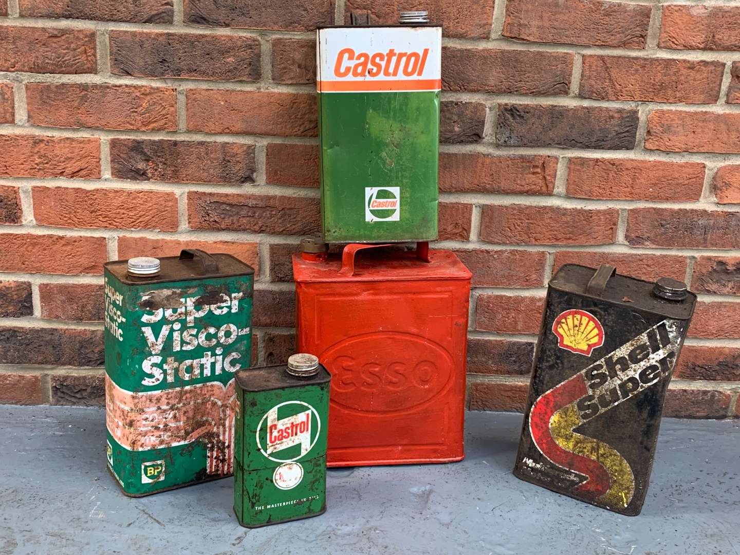 <p>Five Vintage Oil and Fuel Cans</p>