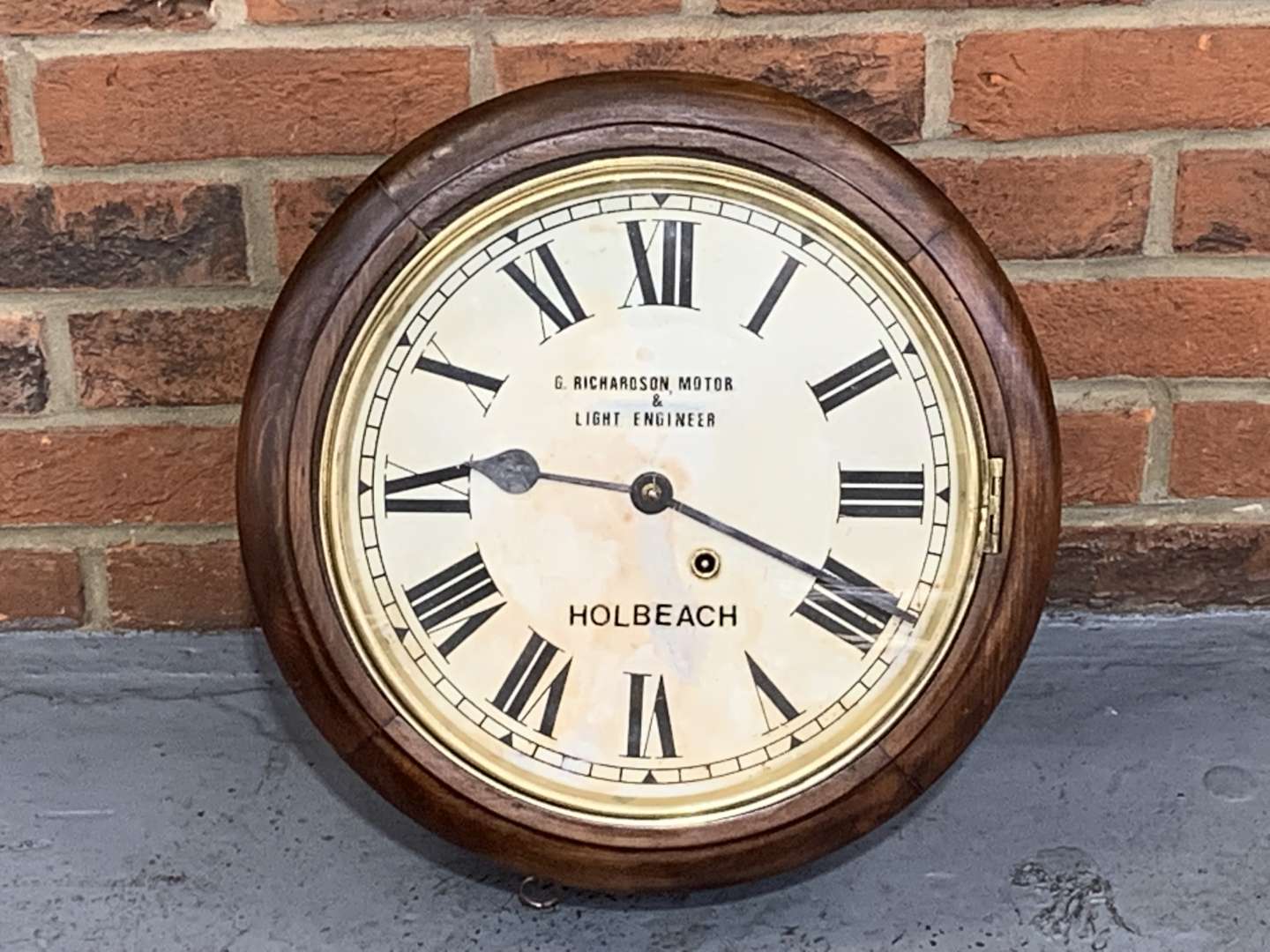 <p>Mahogany Dial Clock "G Richardson Motor Engineer, Holbeach</p>