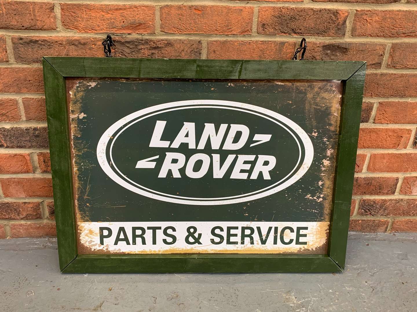 <p>Framed Metal Land Rover Parts and Service Sign</p>