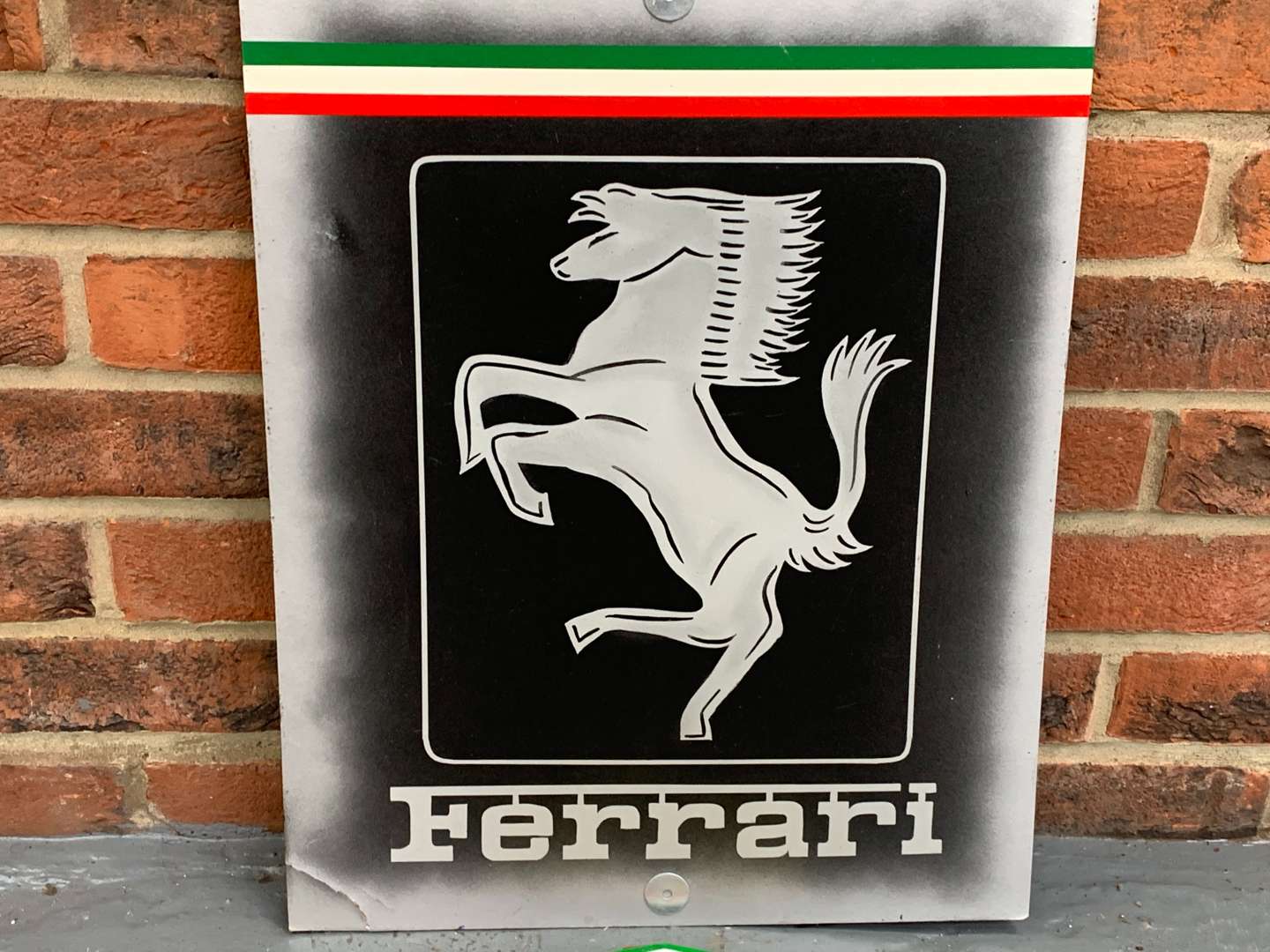 <p>Painted Ferrari Sign and Cast Iron Plaque (2)</p>