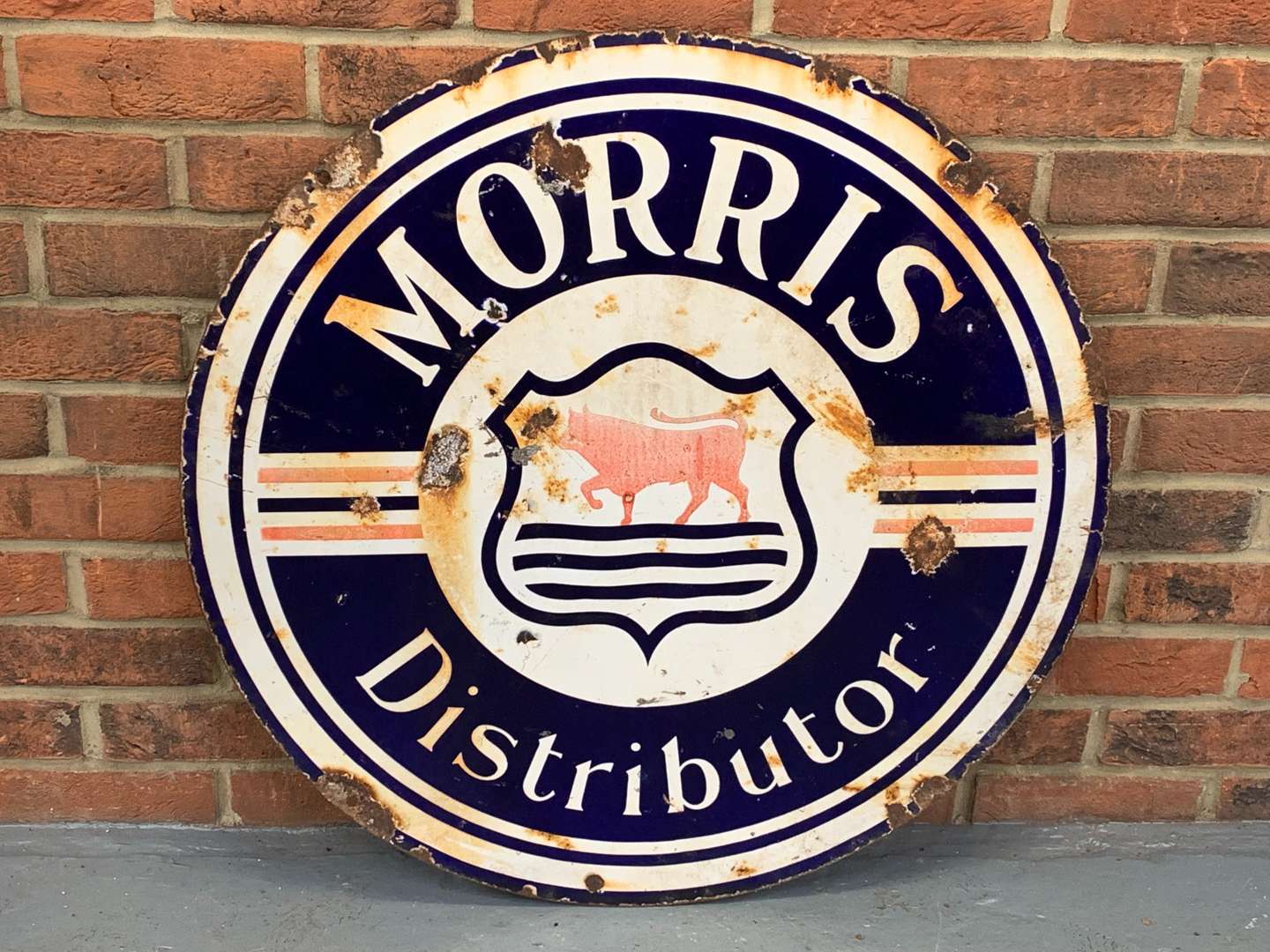 <p>Enamel Morris Distributor Circular Sign</p>