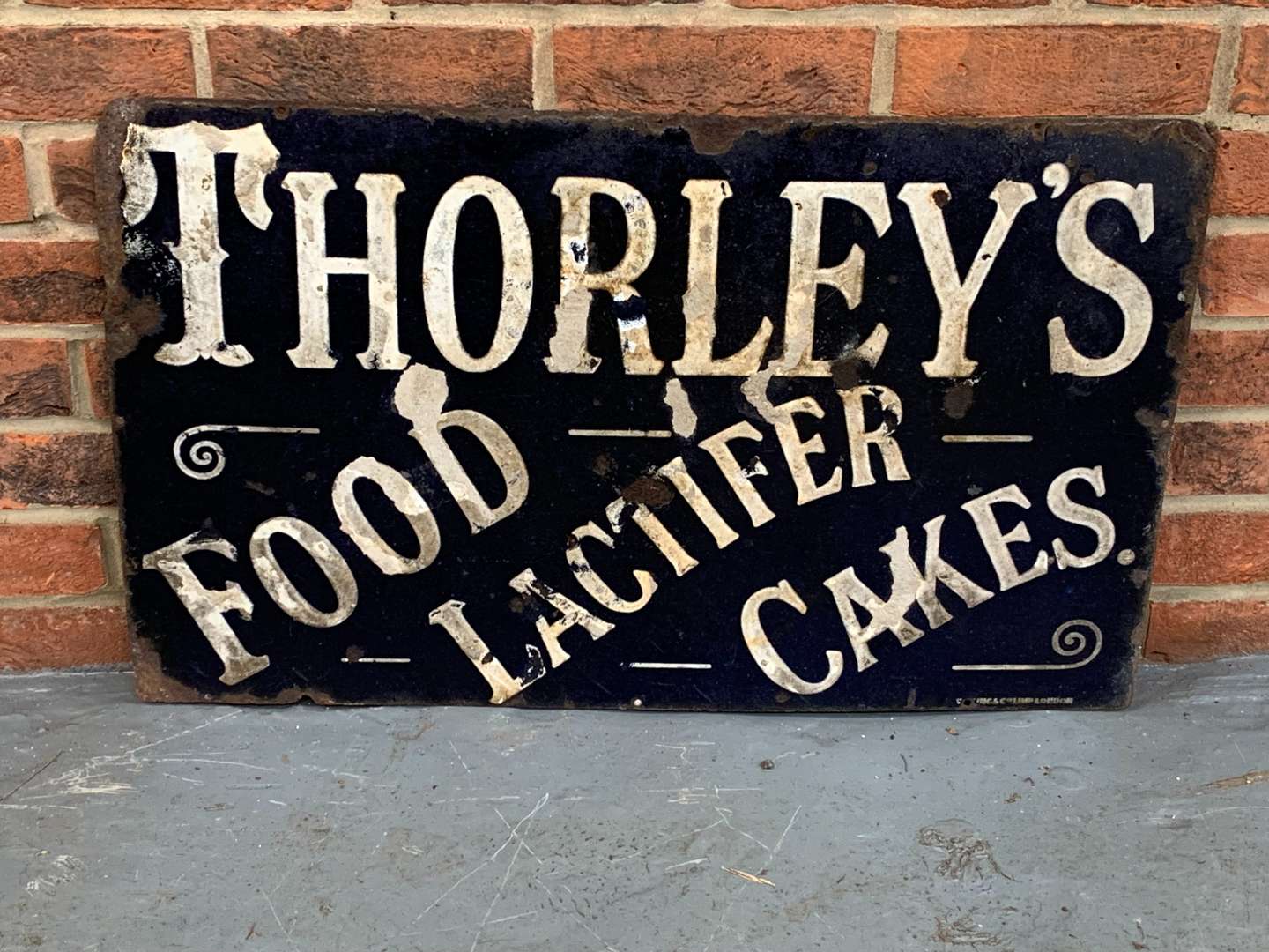 <p>Enamel Thorleys Food, Lactifer, Cakes Sign</p>