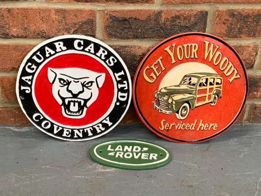 Two Cast Iron Jaguar and Land Rover Signs and Tin Woody Sign (3 ...