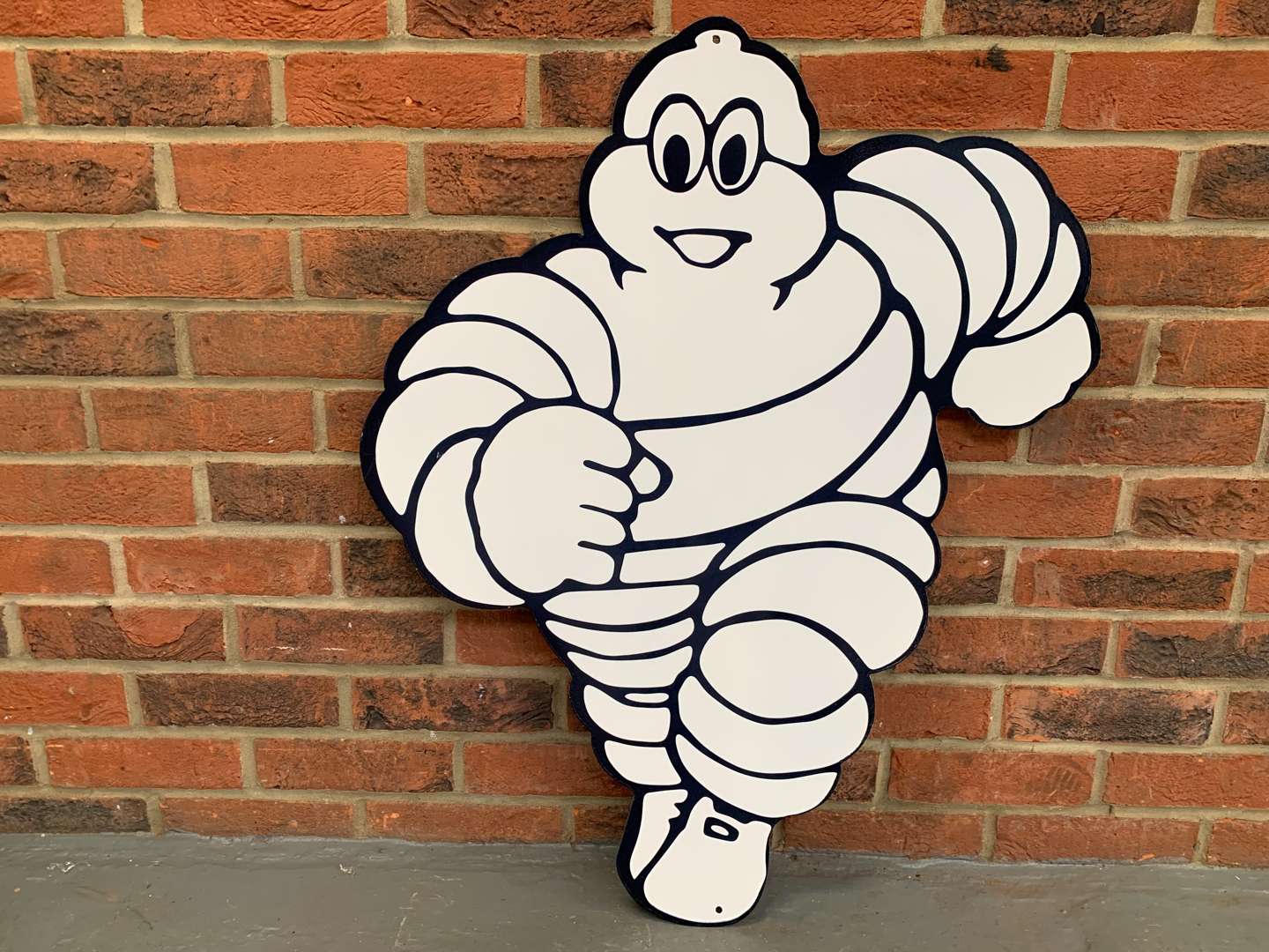 <p>Metal Michelin Running Man Sign</p>