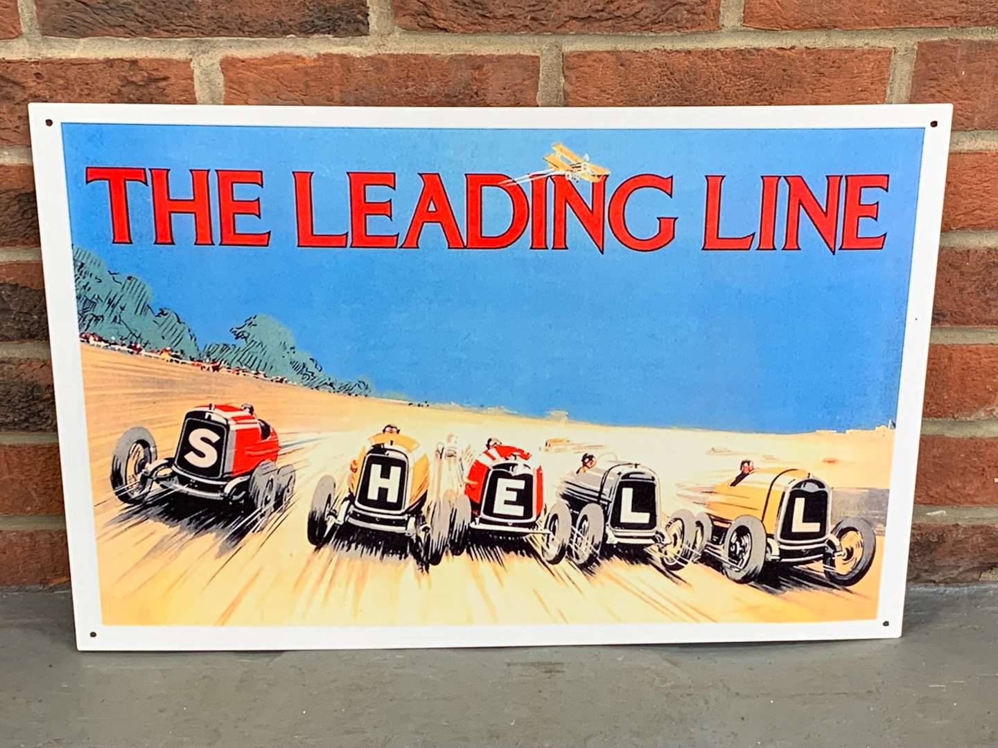 <p>Metal Shell “The Leading Line” Sign</p>