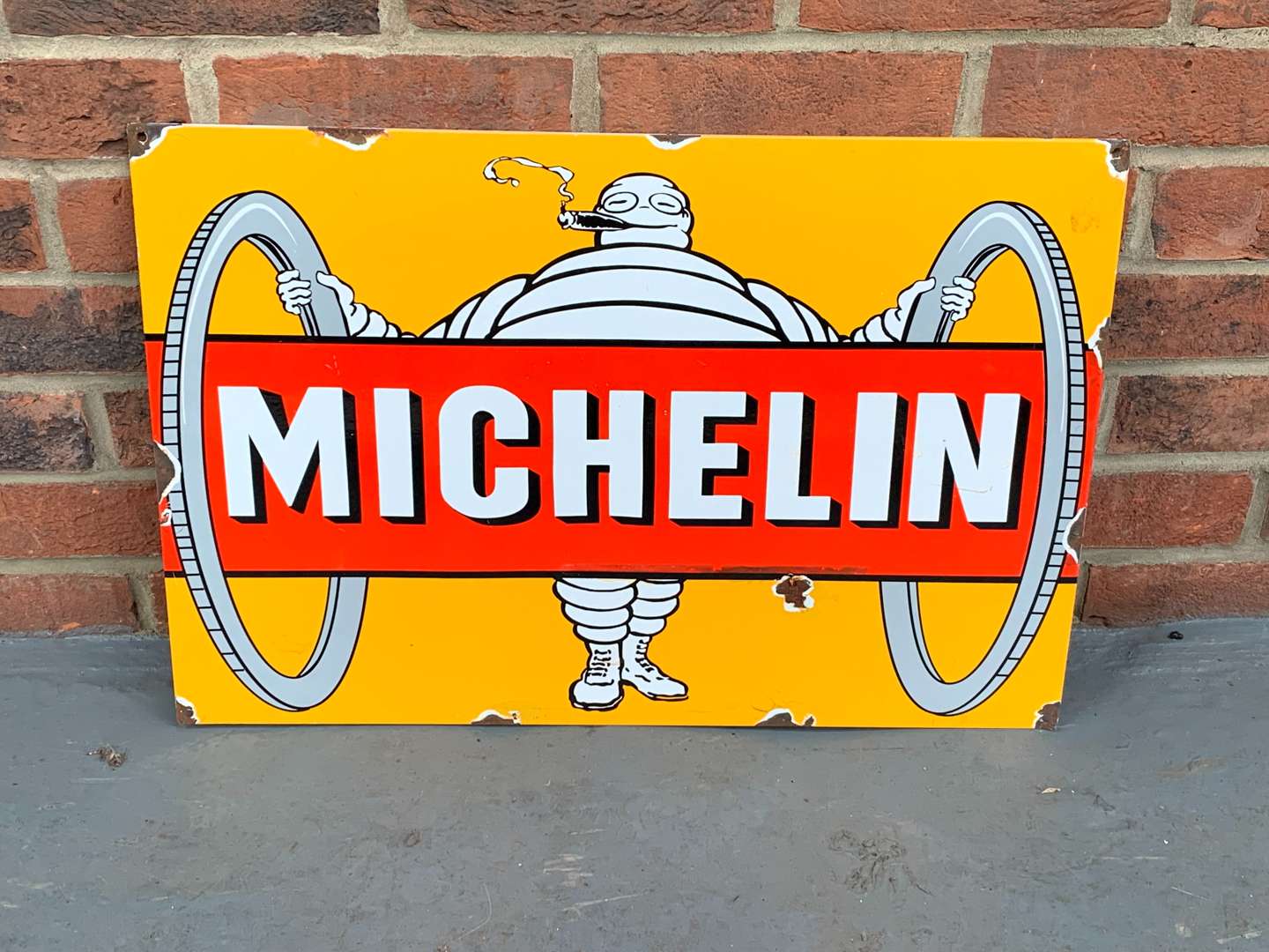 <p>Enamel Michelin Man Sign</p>