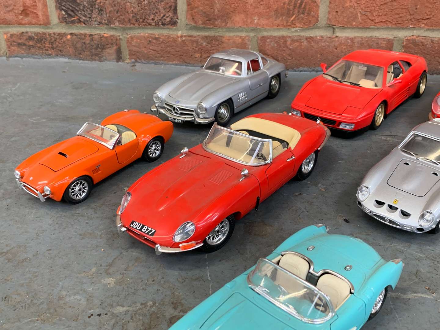 <p>Eight Die Cast Models, To Include Ferrari, AC Cobra, Mercedes 300sl Etc</p>