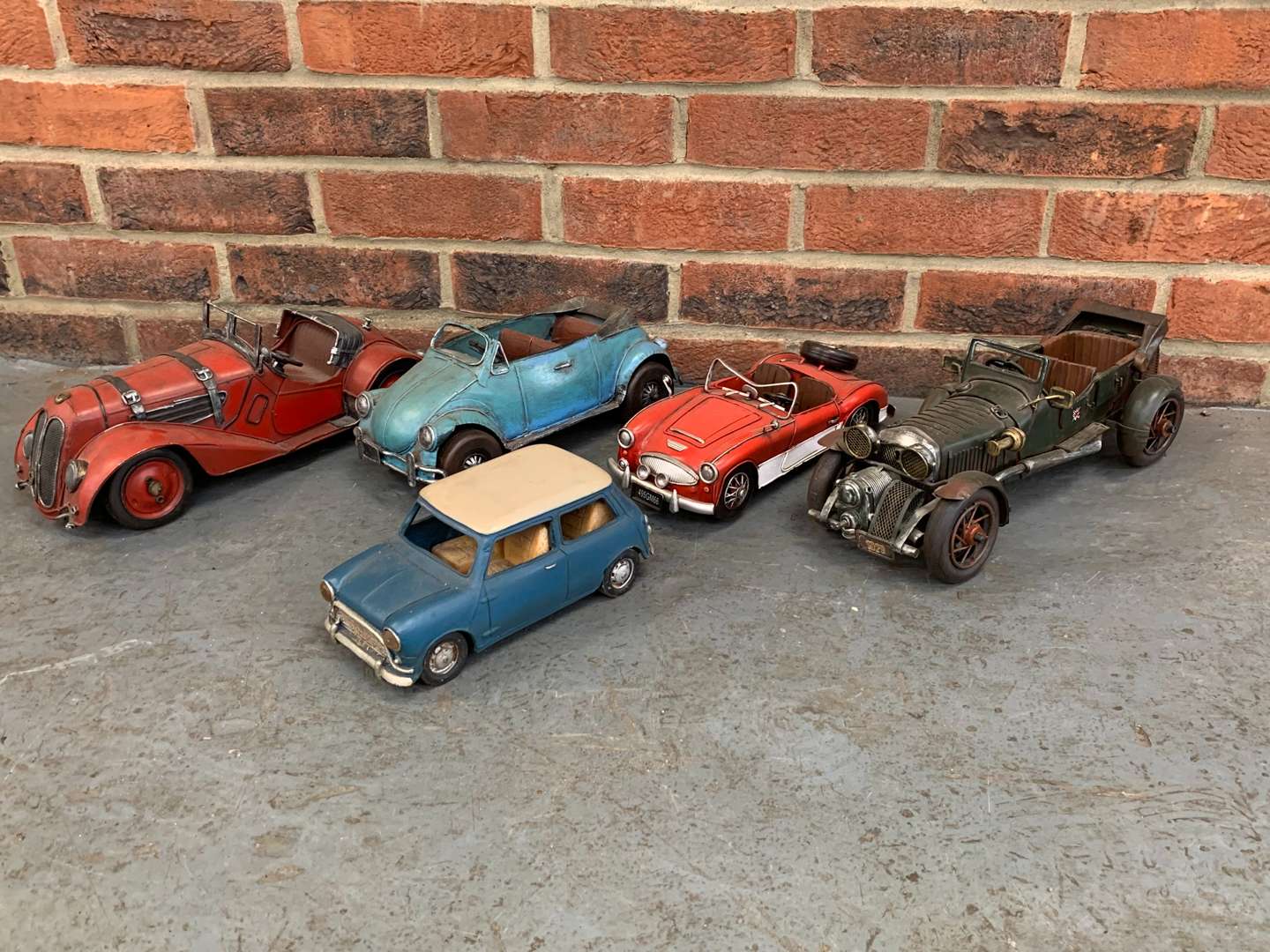 <p>Five Tin Plate Model Cars</p>